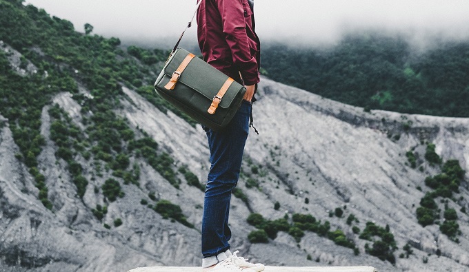 man on mountain with jacket