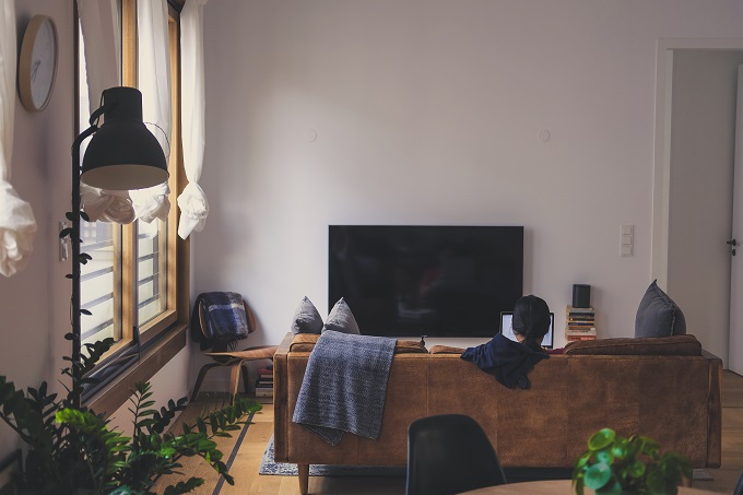 woman using laptop in her living room